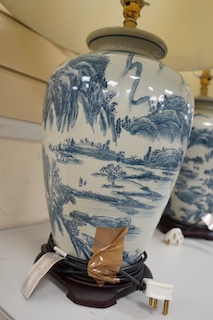 A pair of Japanese blue and white ceramic table lamps and shades, 71cm high overall. Condition - good, untested